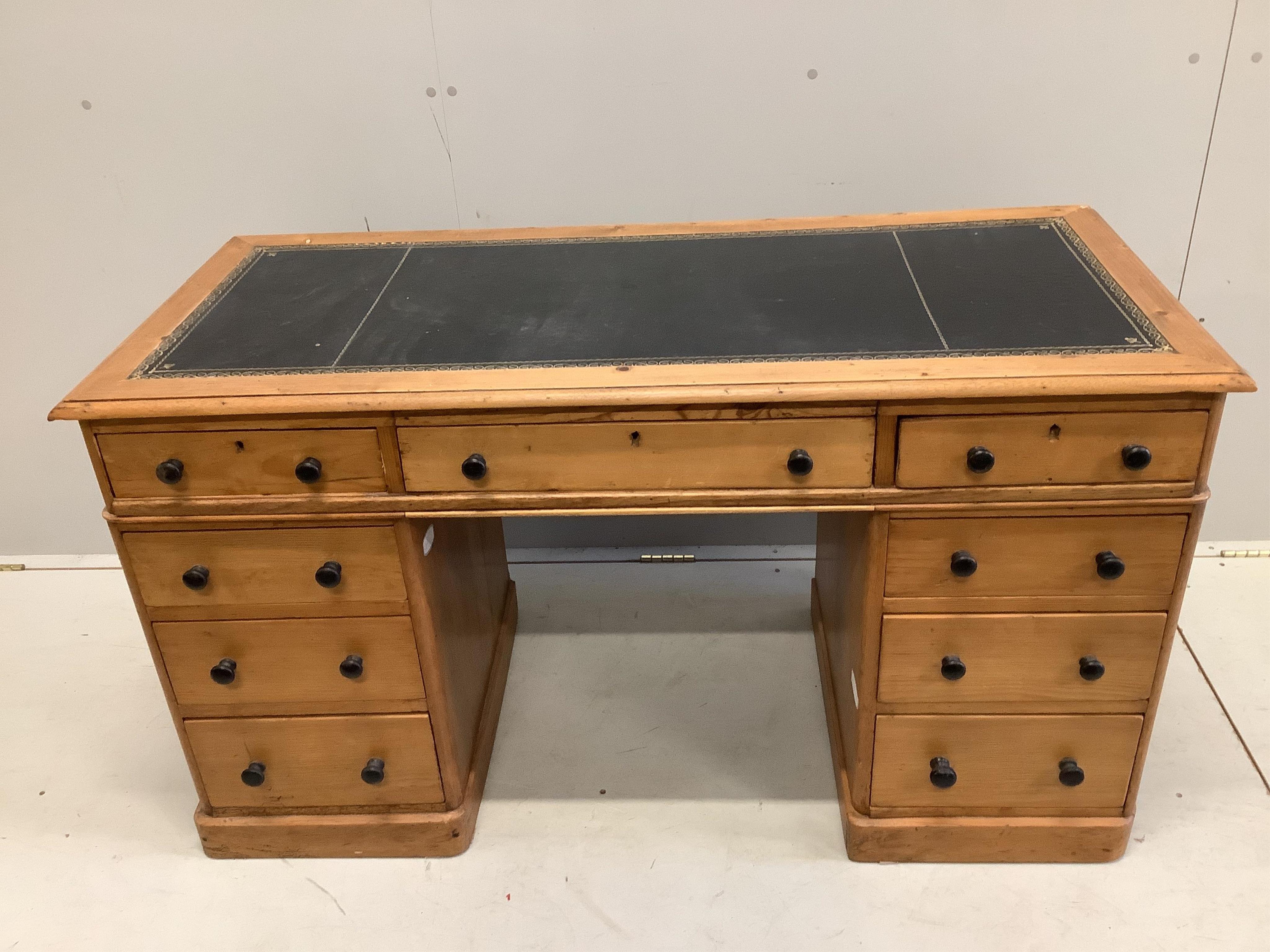 A late Victorian pine pedestal desk, width 131cm, depth 57cm, height 73cm. Condition - fair.